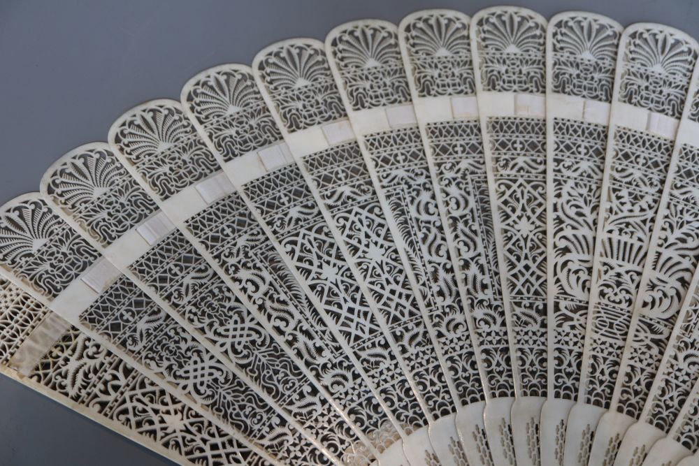 A 19th century French pierced ivory brise fan, length 28cm